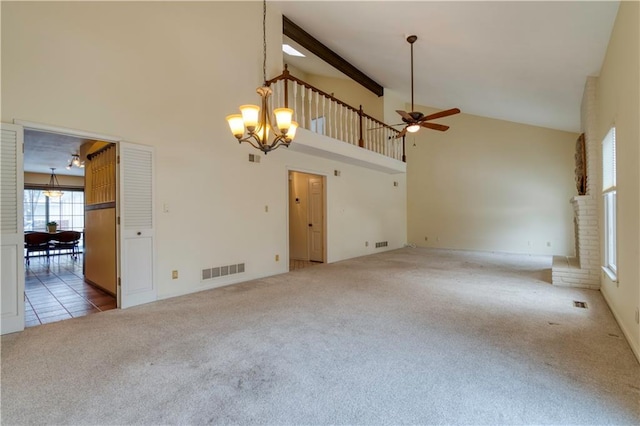 unfurnished living room with carpet, ceiling fan with notable chandelier, beamed ceiling, and high vaulted ceiling