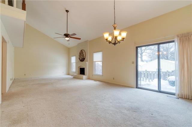 unfurnished living room with a fireplace, light carpet, ceiling fan with notable chandelier, and high vaulted ceiling