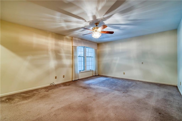 empty room with carpet and ceiling fan