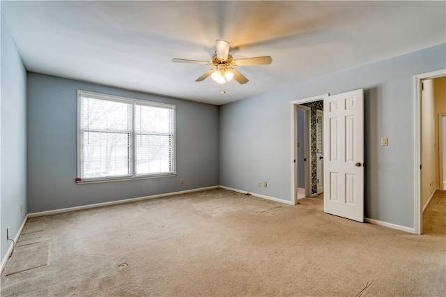 carpeted empty room with ceiling fan