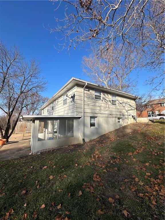 view of side of home with a sunroom