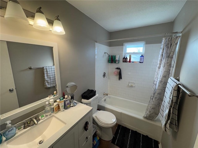 full bathroom with shower / bath combination with curtain, vanity, toilet, and a textured ceiling