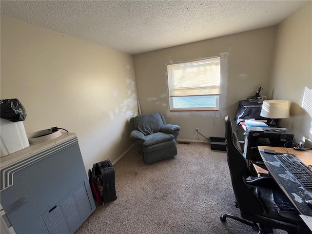 office featuring carpet flooring and a textured ceiling