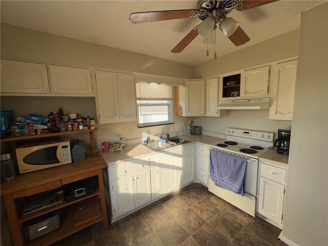 kitchen with white appliances, sink, a textured ceiling, and white cabinets