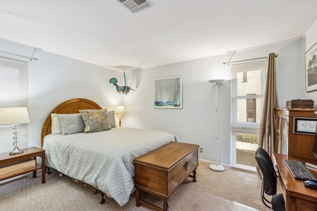 bedroom with light carpet