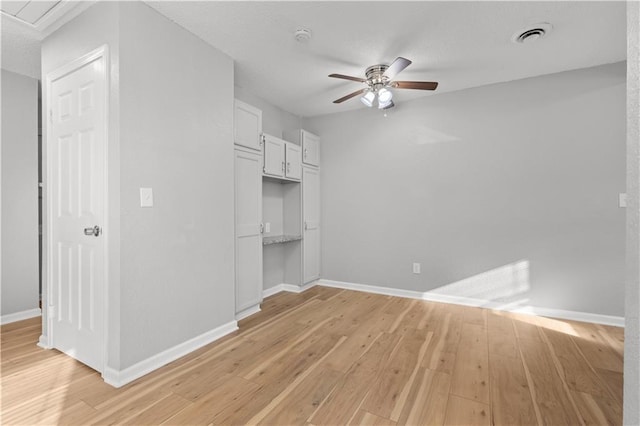 interior space featuring light wood-type flooring and ceiling fan