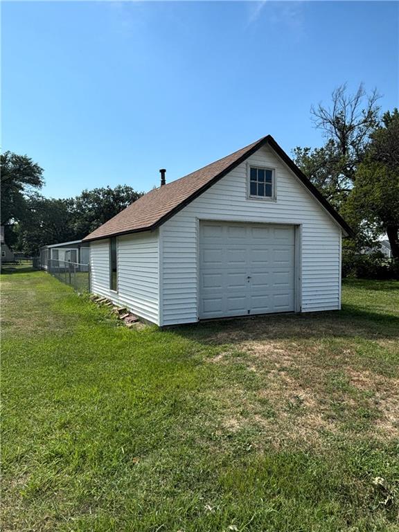 garage with a yard