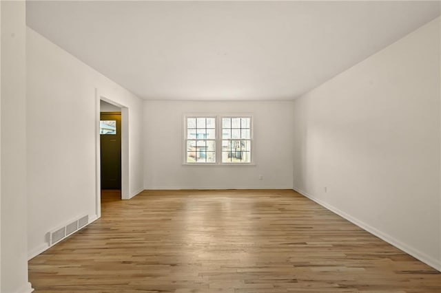 spare room with light wood-type flooring