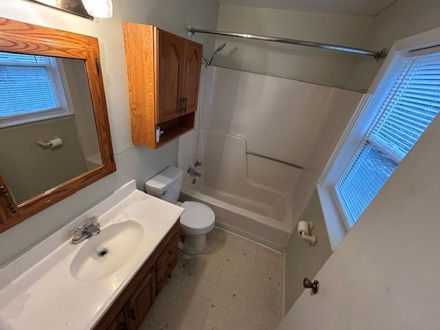 full bathroom with shower / bathing tub combination, vanity, and toilet