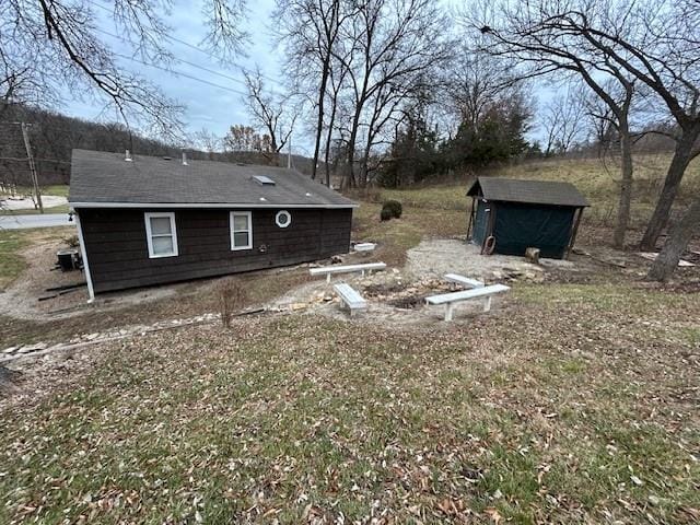 exterior space featuring a storage shed