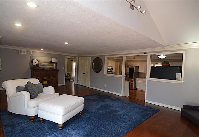 living room with dark hardwood / wood-style flooring, crown molding, and a textured ceiling