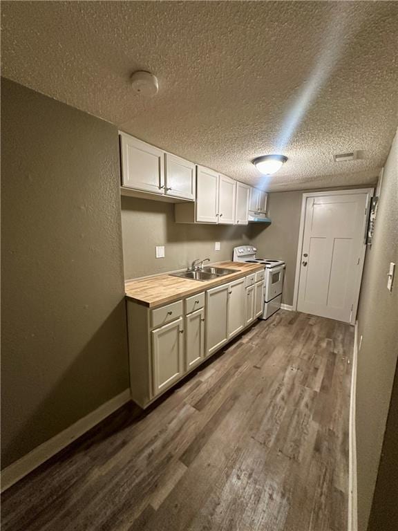 kitchen featuring wood counters, white electric range, sink, dark hardwood / wood-style floors, and white cabinetry