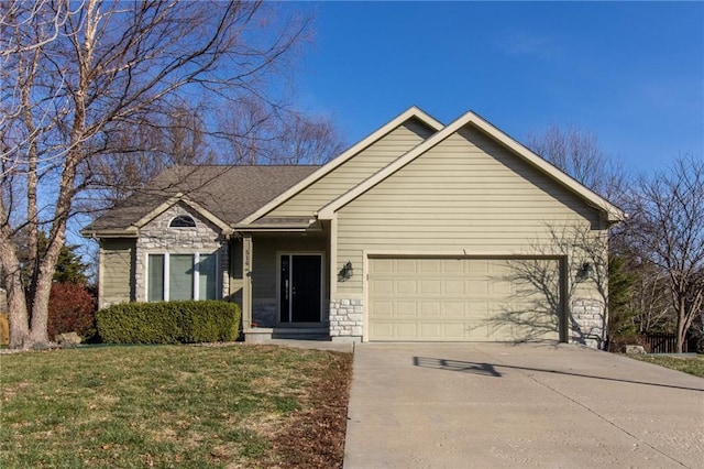 ranch-style house featuring a garage and a front yard