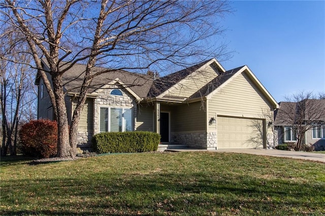 view of front of property with a front yard and a garage