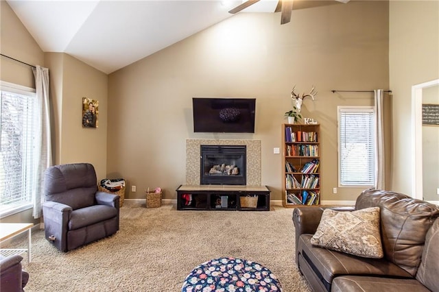 carpeted living room featuring ceiling fan and vaulted ceiling