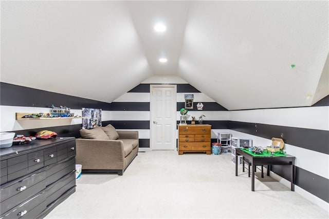 interior space with carpet flooring and vaulted ceiling