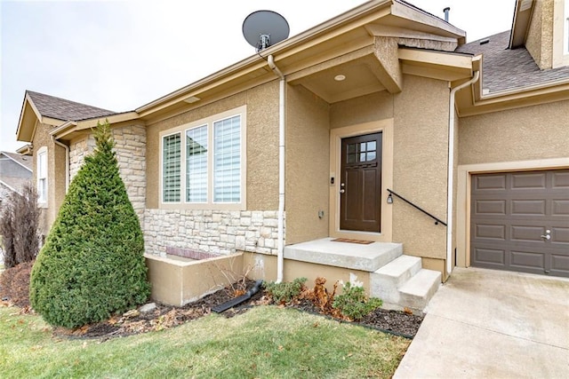 doorway to property with a garage