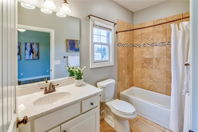 full bathroom with tile patterned floors, shower / bath combo with shower curtain, vanity, and toilet