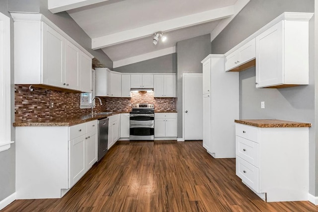 kitchen featuring vaulted ceiling with beams, stainless steel appliances, and white cabinetry