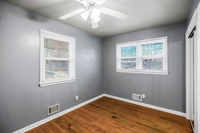 spare room with ceiling fan and hardwood / wood-style floors