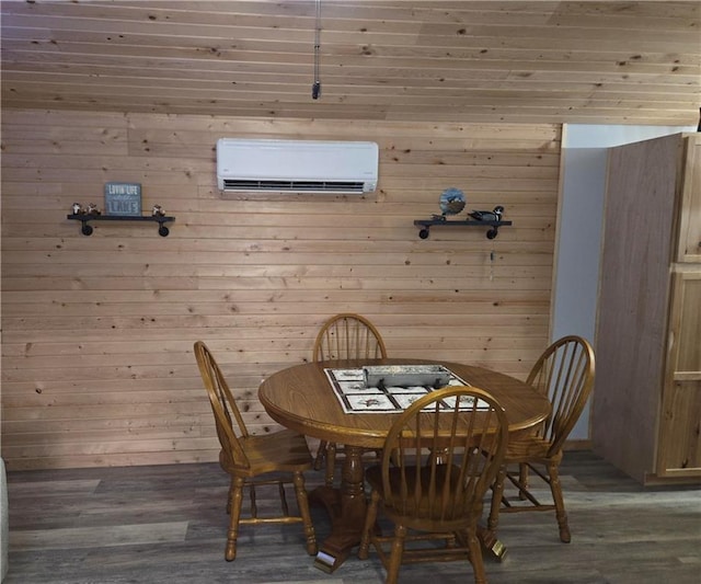 dining area featuring hardwood / wood-style flooring, an AC wall unit, and wooden walls