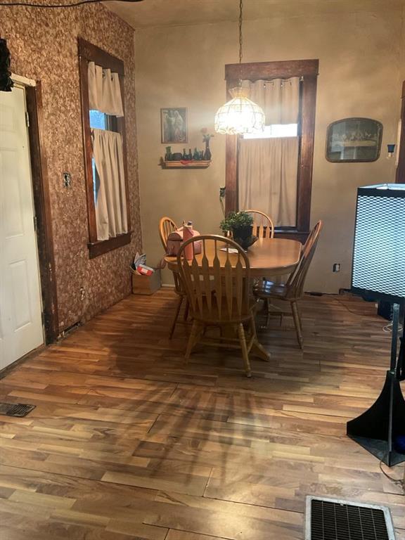 dining space featuring hardwood / wood-style flooring