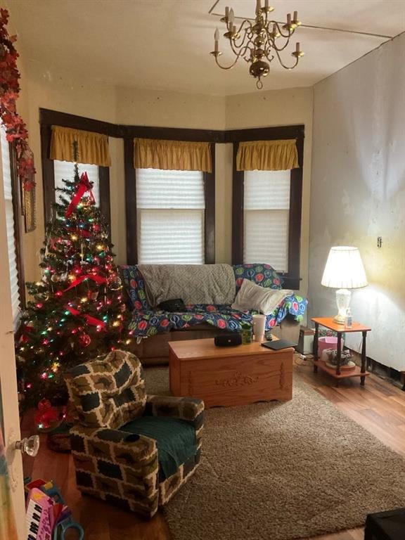 living room featuring a chandelier and hardwood / wood-style flooring