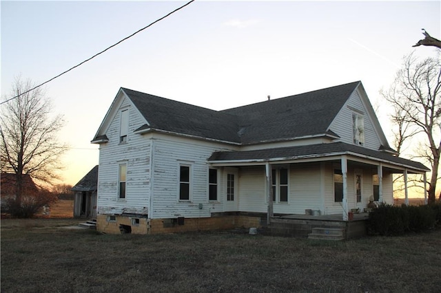 exterior space with a porch and a yard