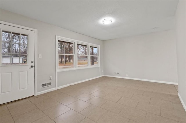 foyer featuring a textured ceiling