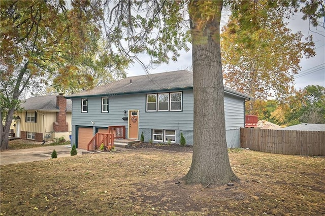 bi-level home featuring a garage