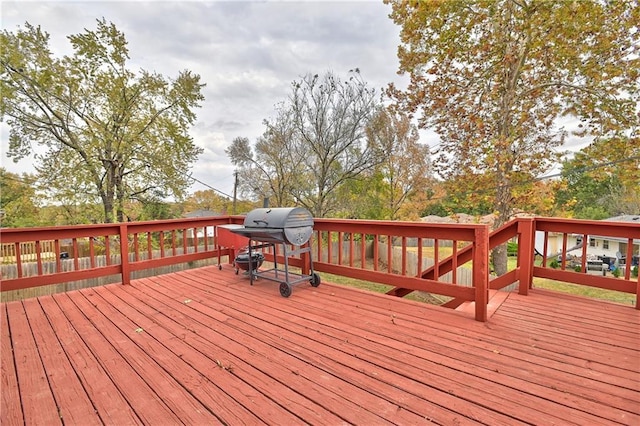 wooden terrace featuring area for grilling