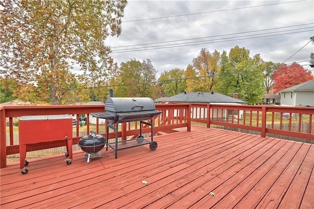 wooden terrace with a grill