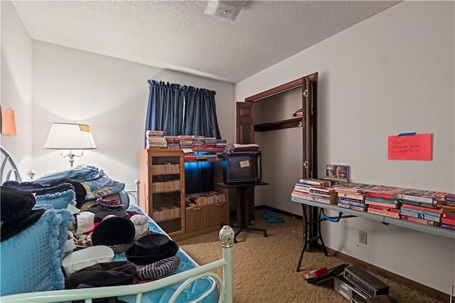 carpeted bedroom with a textured ceiling