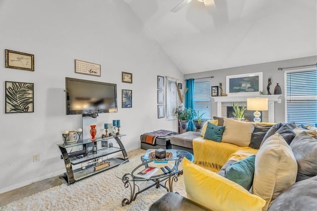 living room with carpet flooring, ceiling fan, and high vaulted ceiling