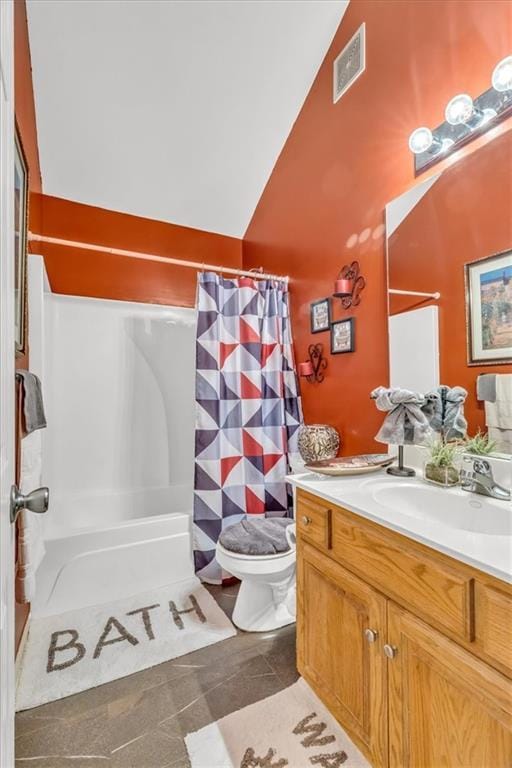 full bathroom featuring tile patterned flooring, vaulted ceiling, toilet, shower / bath combo with shower curtain, and vanity