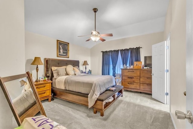 bedroom with light carpet, vaulted ceiling, and ceiling fan