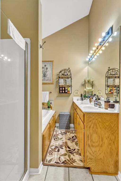 bathroom with vanity, tile patterned floors, lofted ceiling, and separate shower and tub