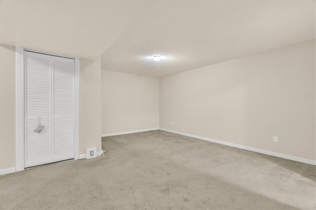 unfurnished bedroom featuring carpet and a closet