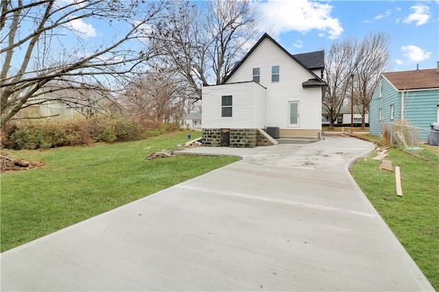 back of house featuring a yard