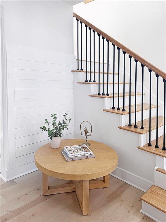 interior space with baseboards and wood finished floors