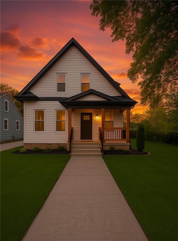 411 Charles, Warrensburg, MO 64093 - view of front facade with covered porch and a front lawn