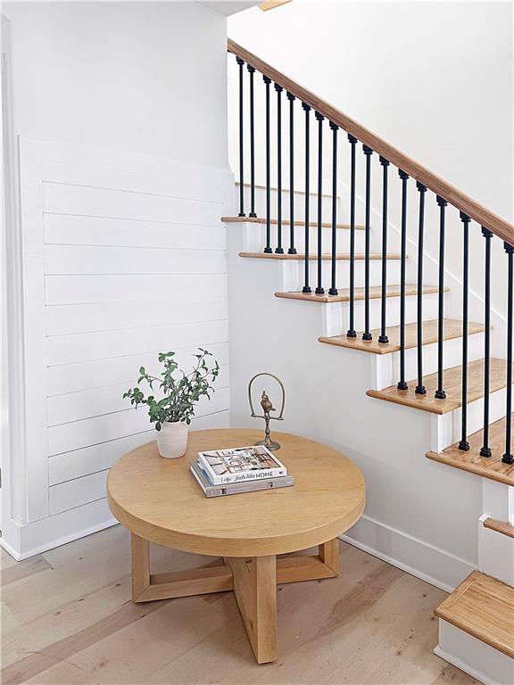 411 Charles, Warrensburg, MO 64093 - stairway featuring wood finished floors and baseboards