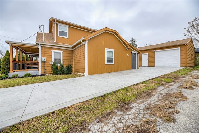 front of property featuring covered porch and a garage