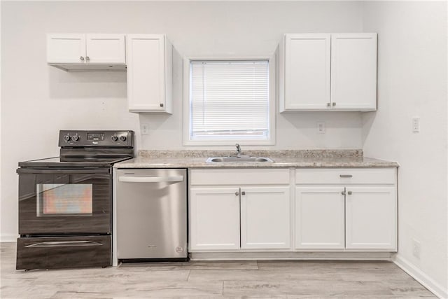 kitchen featuring dishwasher, sink, white cabinetry, and range with electric cooktop