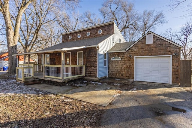 view of front facade with a garage and covered porch