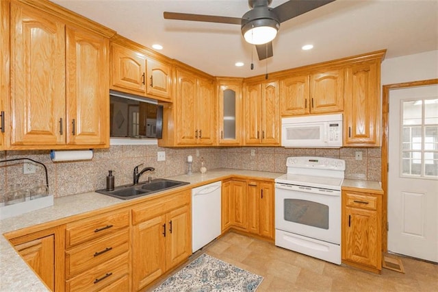 kitchen featuring ceiling fan, white appliances, sink, and decorative backsplash