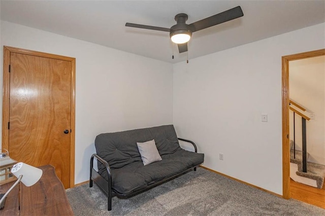 sitting room with carpet floors and ceiling fan