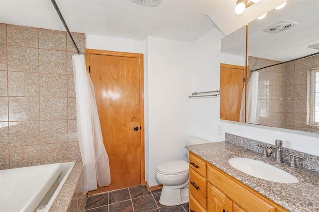 full bathroom featuring tile patterned flooring, shower / bath combo, vanity, and toilet