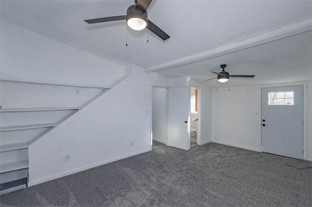 unfurnished living room with carpet flooring and ceiling fan