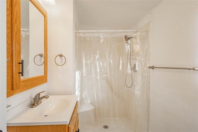 bathroom featuring vanity and a shower with curtain